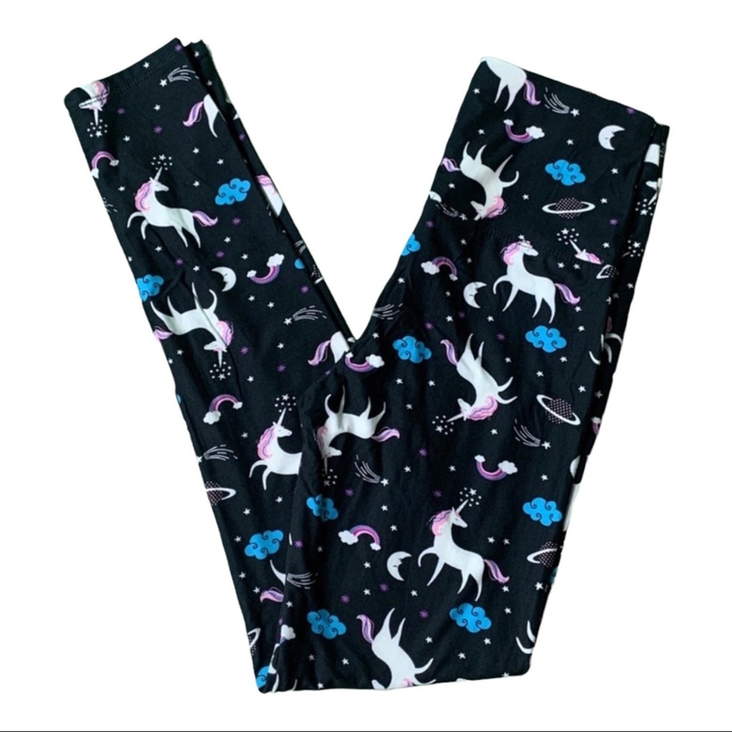 Black leggings with unicorn and rainbow pattern on a white background