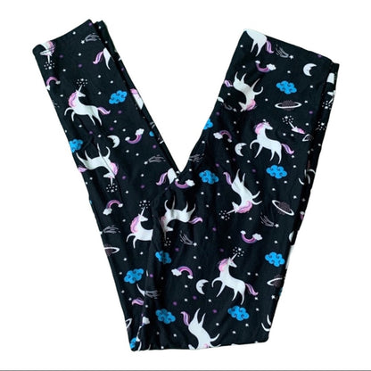 Black leggings with unicorn and rainbow pattern on a white background