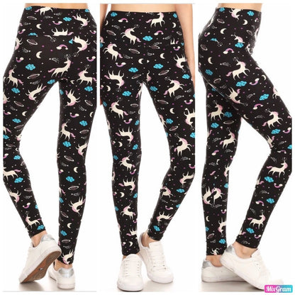 Black leggings with colorful unicorn pattern worn by a person on a white background