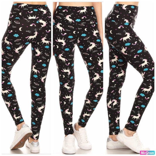 Black leggings with colorful unicorn pattern worn by a person on a white background