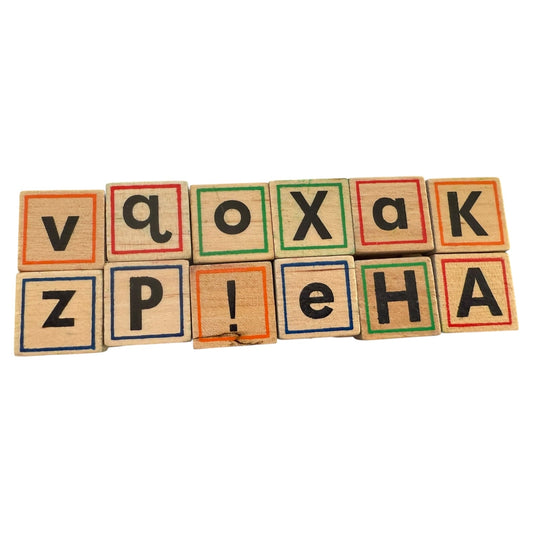 Colorful wooden block stamps with letters on a white background