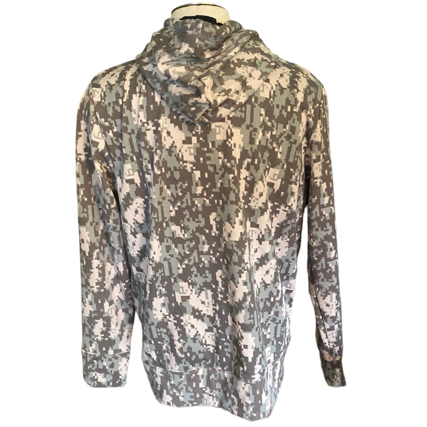 A long-sleeve hooded jacket with a digital camouflage pattern , displayed on a mannequin torso against a white background.