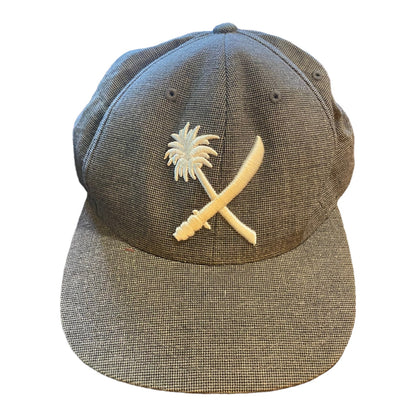 Front of Gray cap with a palm tree and crossbones design on a white background