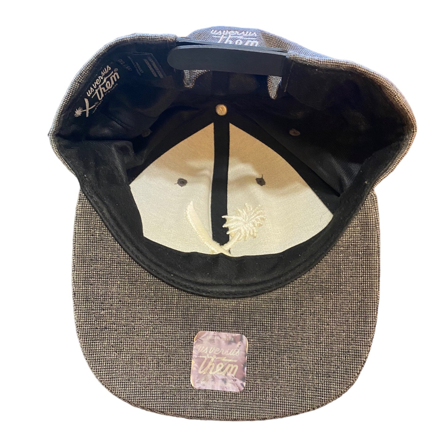 Baseball cap with textured brim and embroidered logo on a white background