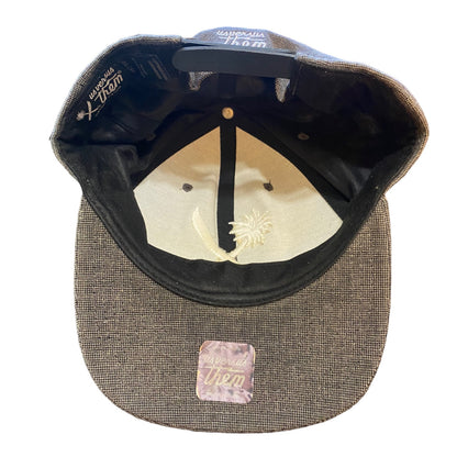 Baseball cap with textured brim and embroidered logo on a white background