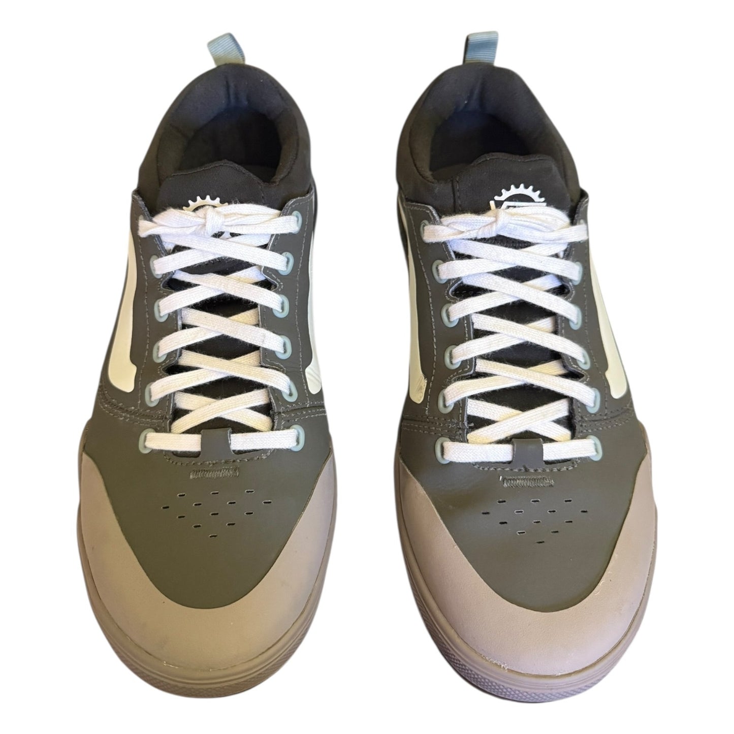 Front of Pair of green sneakers with white laces on a white background