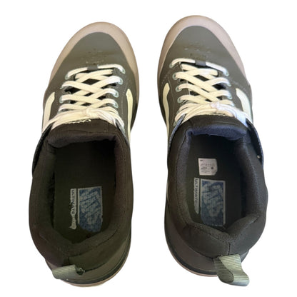 Top of a Pair of green sneakers with white laces on a white background