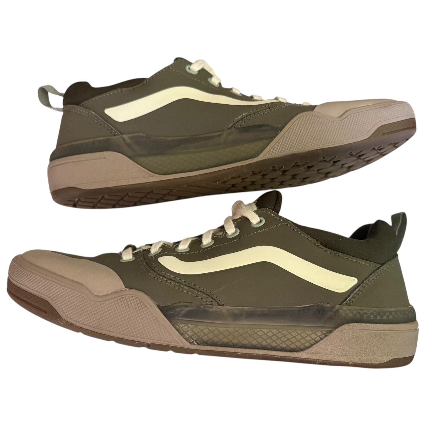 Side view of a Pair of green sneakers on a white background