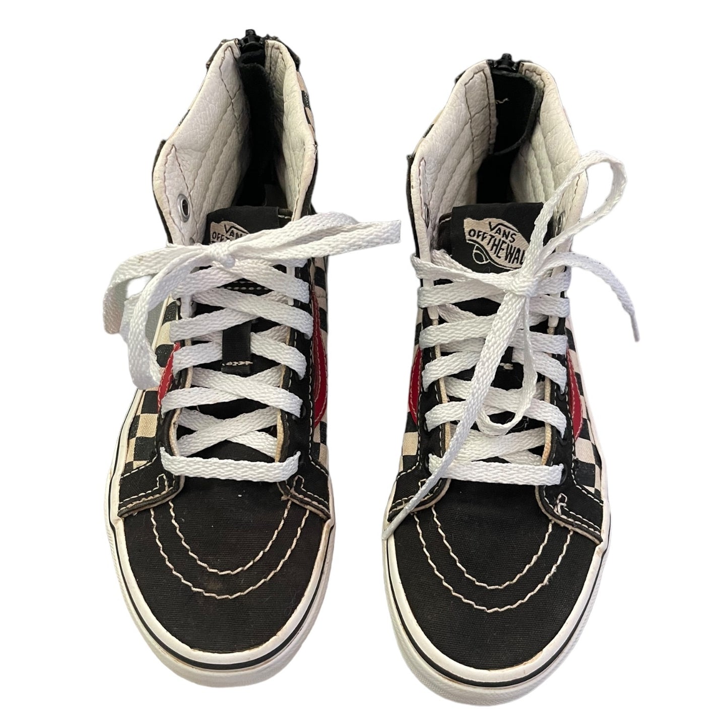 Top of Pair of black high-top sneakers with white laces on a white background