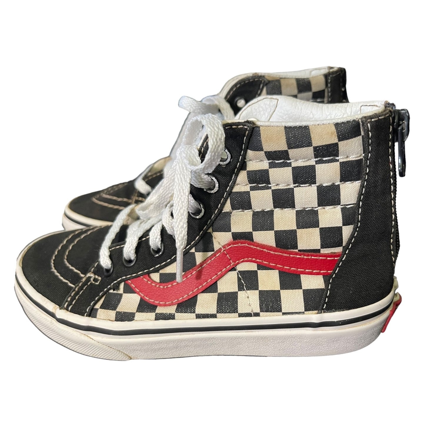 Pair of checkered high-top sneakers with a red swoosh logo on a white background