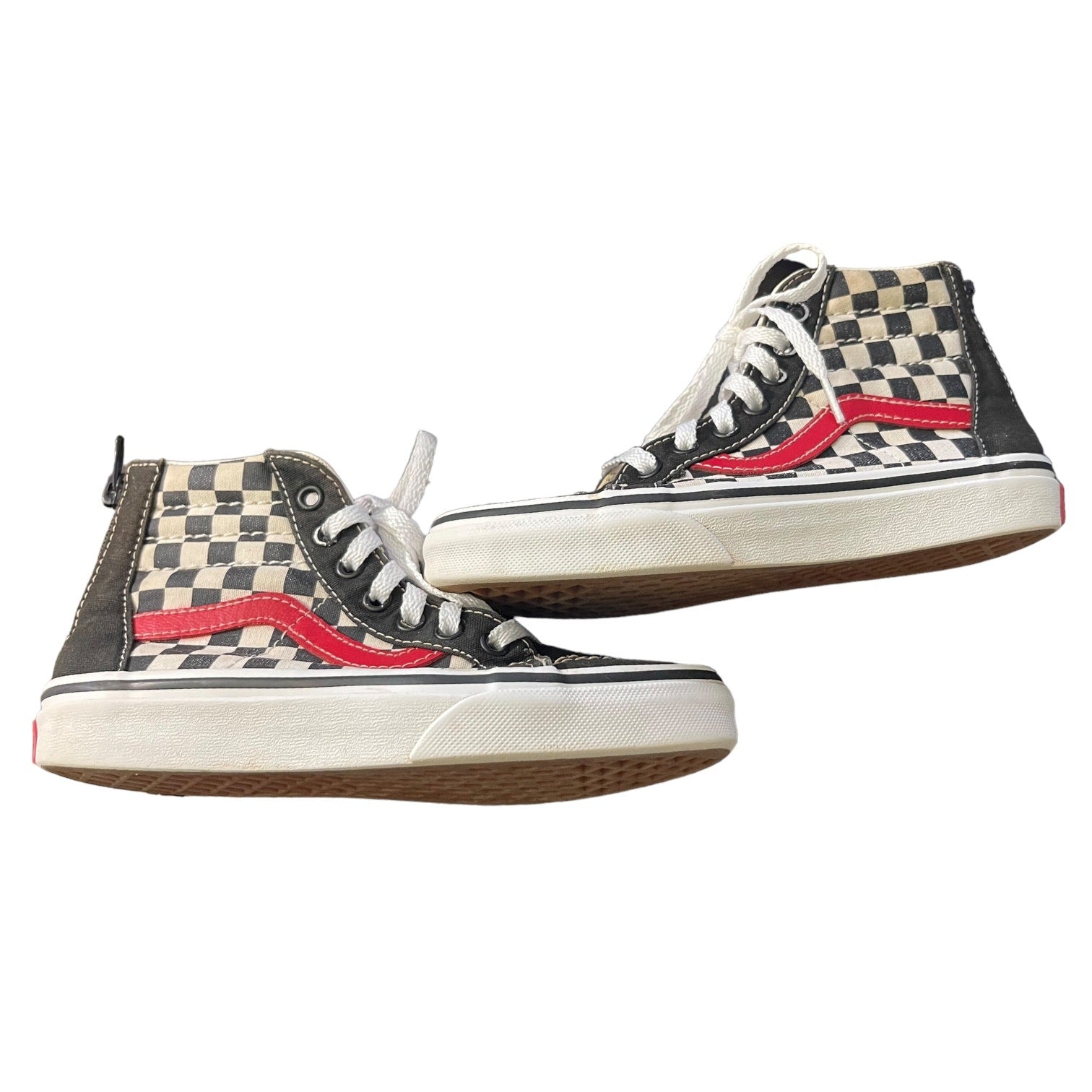 Side view of Pair of checkered high-top sneakers with red accents on a white background