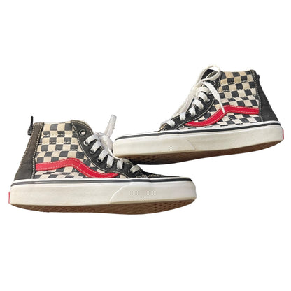 Side view of Pair of checkered high-top sneakers with red accents on a white background