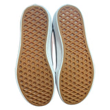 Close-up of brown shoe soles with a white border on a white background