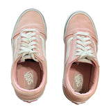 Top of a Pair of pink Vans sneakers on a white background