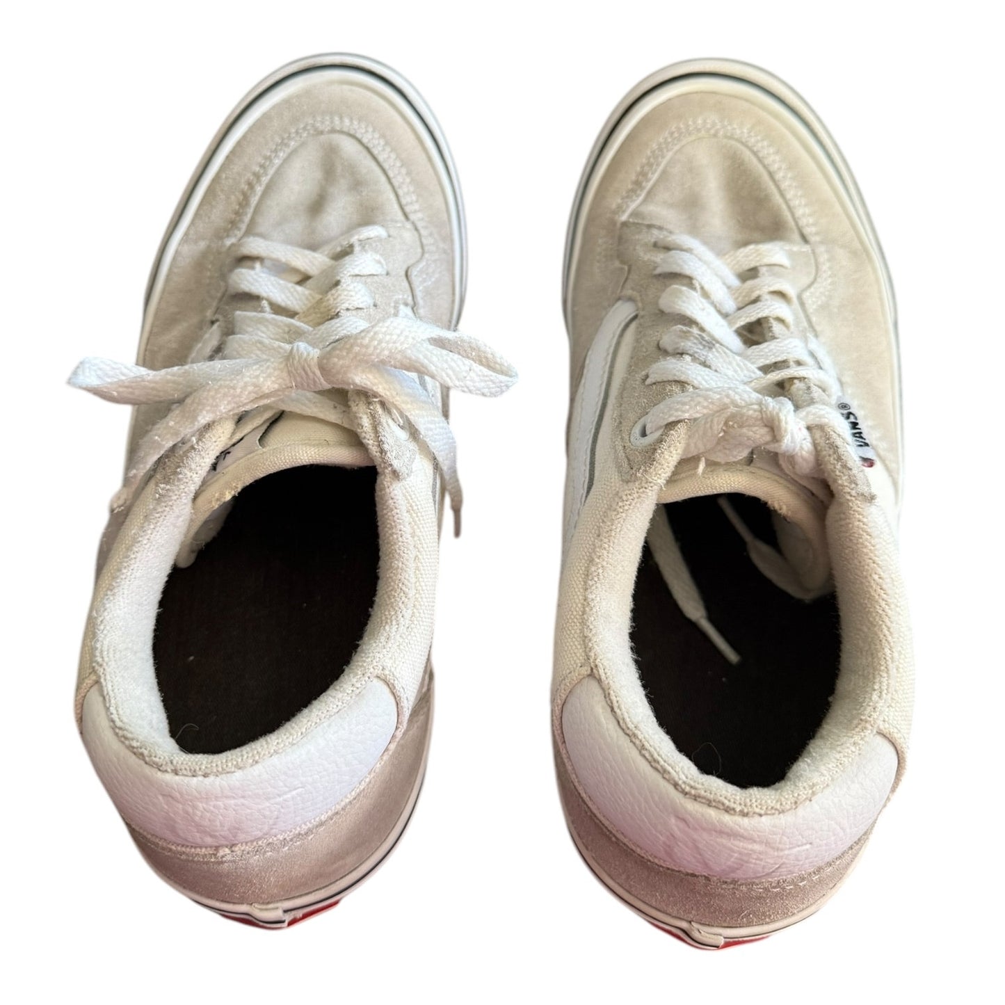 Top of white sneakers on a white background