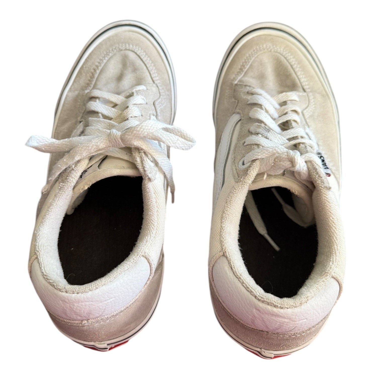 Top of white sneakers on a white background