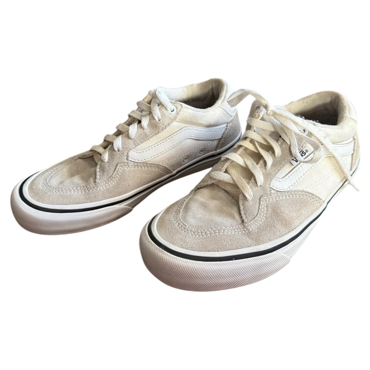 White Vans front side of sneakers with white laces on a white background