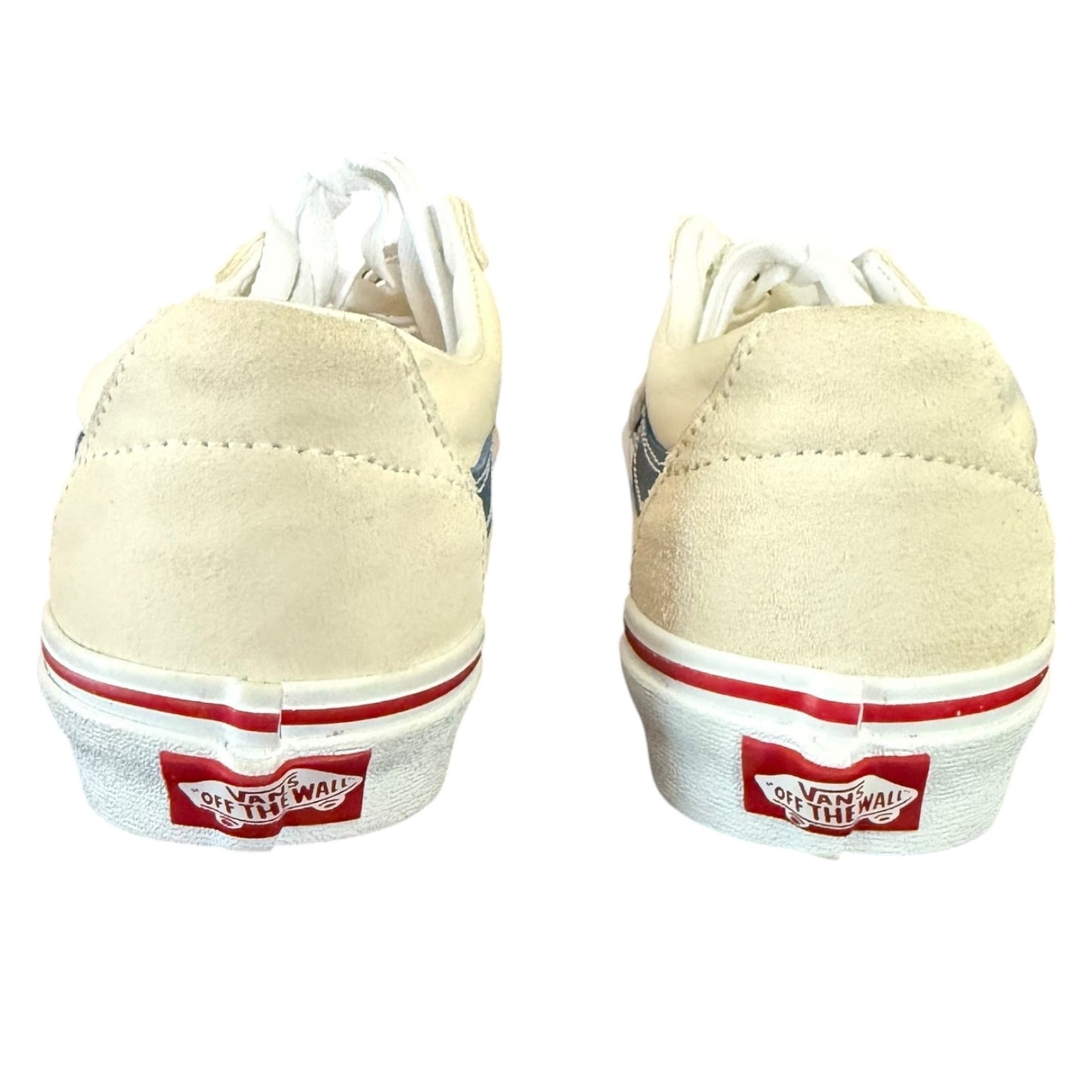 Back of cream sneakers with red and white accents on a white background