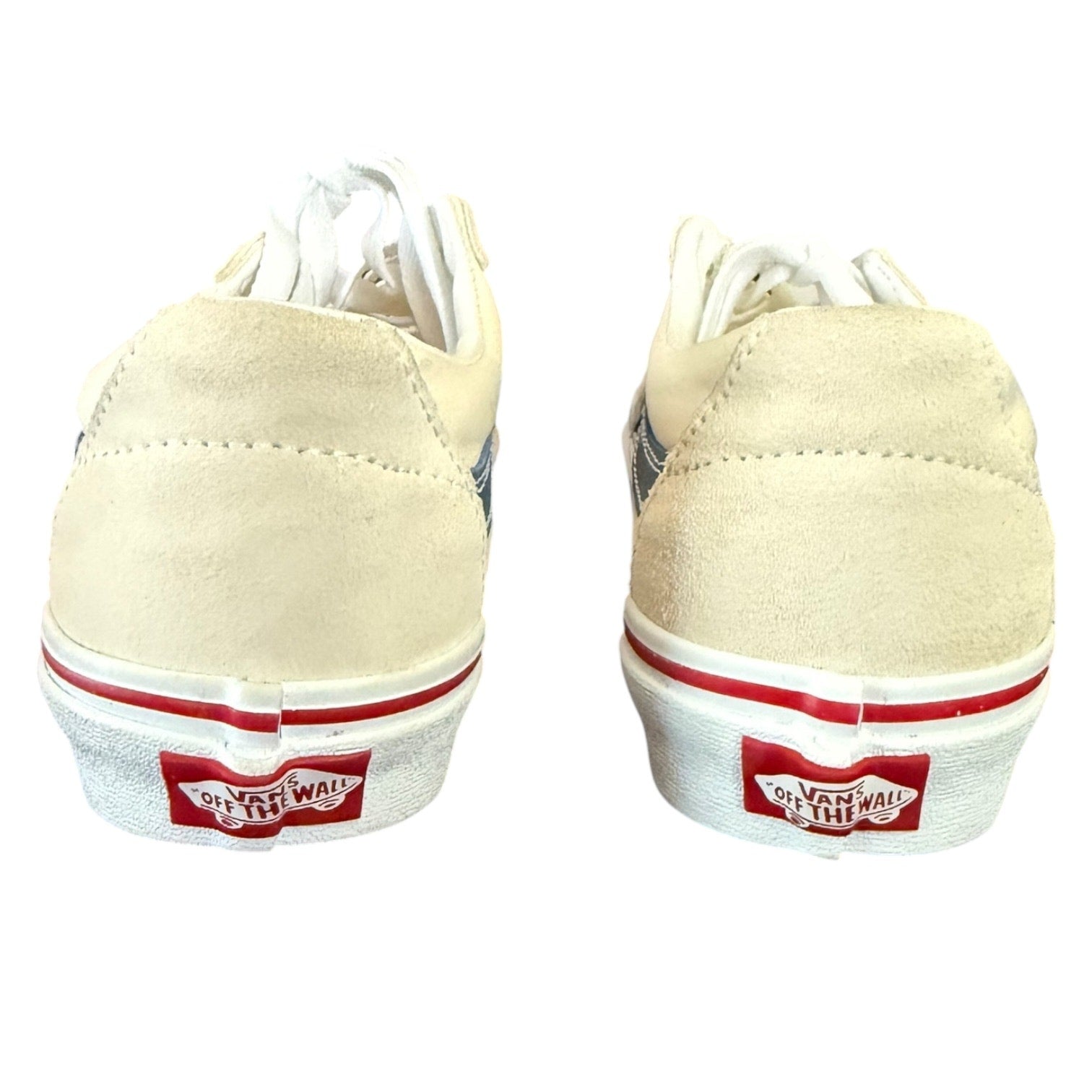 Back of cream sneakers with red and white accents on a white background