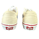 Back of cream sneakers with red and white accents on a white background