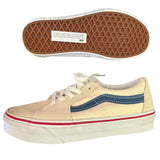 Bottom of cream sneakers on a white background