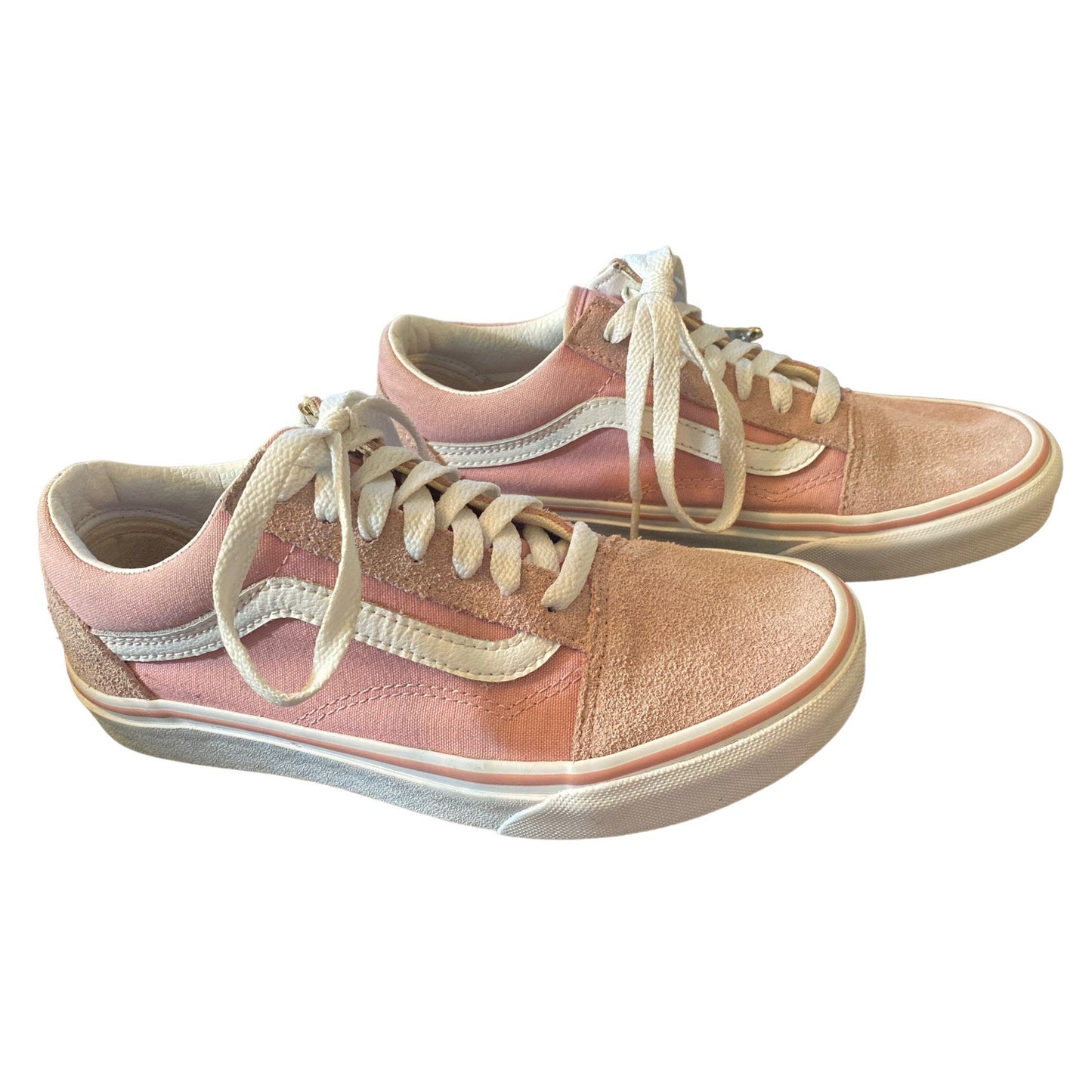 A pair of Vans platform sneakers in a  pink colorway, featuring off-white laces and a thick white rubber sole.