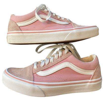 A pair of low-top sneakers in pink suede and canvas, featuring white side stripes, white laces, and a white sole.