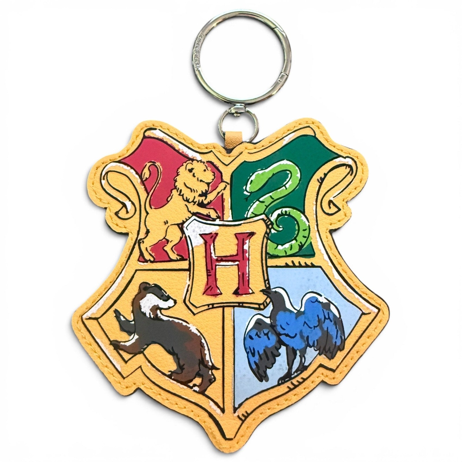 Bag charm with Hogwarts school crest design on a white background