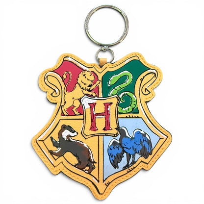 Bag charm with Hogwarts school crest design on a white background