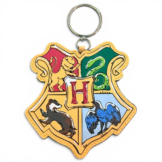 Bag charm with Hogwarts school crest design on a white background