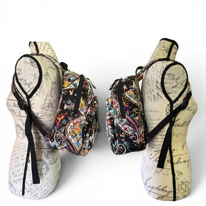 Side view of backpack on mannequin stands against a white background