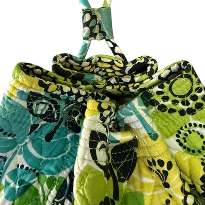 Top of backpack colorful patterned fabric squares with a white background