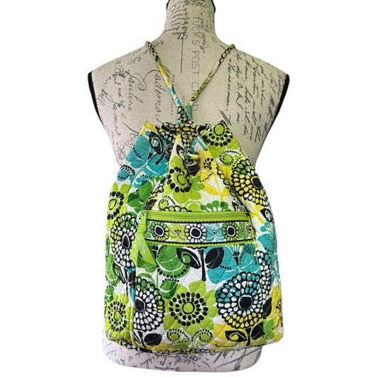 Colorful floral-patterned drawstring backpack on a mannequin with a white background