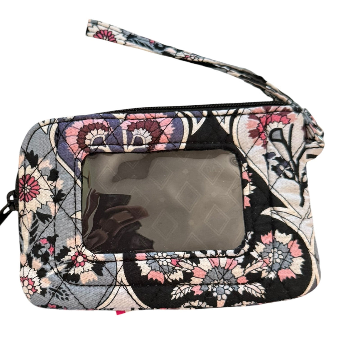 Floral patterned clutch wristlet bag on a white background