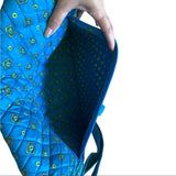 Interior of back pocket on blue messenger