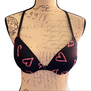 front of black with candy cane hearts bra