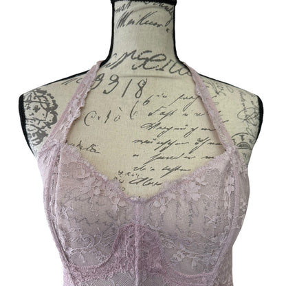 Lace bustier bra top on a mannequin with vintage-style text background