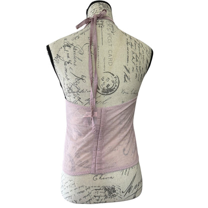 Back of lace and mesh bustier bra top on a mannequin against a white background