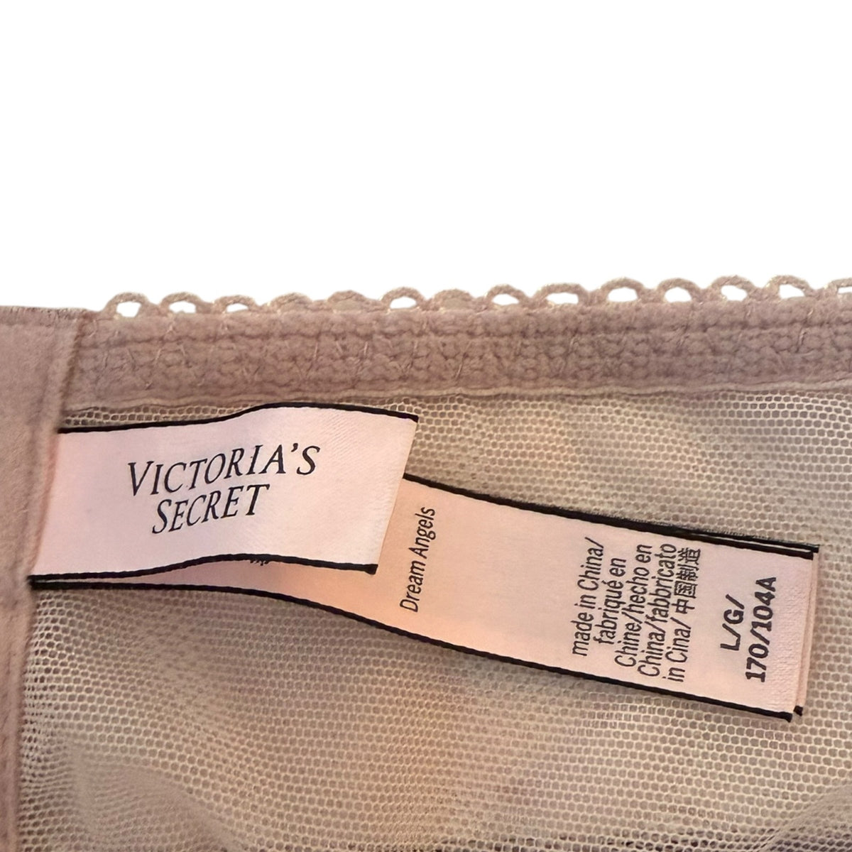 Victoria's Secret label on a garment with mesh fabric.