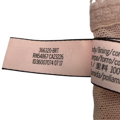 Close-up of a fabric label with text on a white background