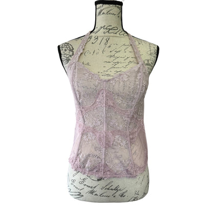 Lace bustier bra top on a mannequin with a vintage-style script background