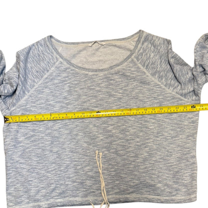 Blue shirt and a measuring tape across it on a white background
