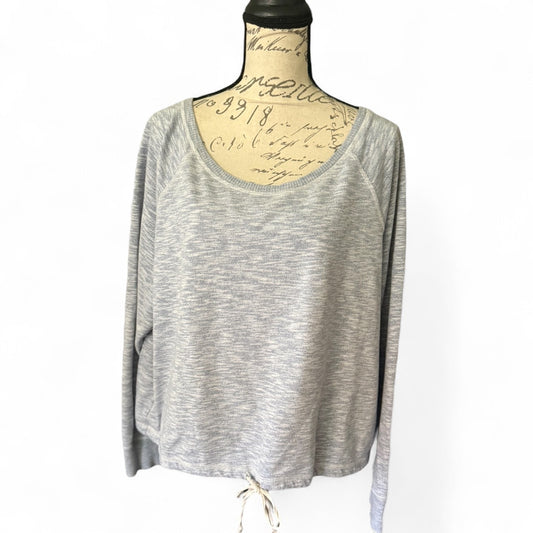 Front of long-sleeve top on a mannequin with a white background