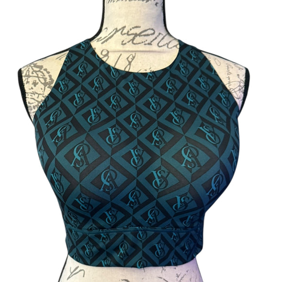 Black and green patterned sports bra on a mannequin with a white background