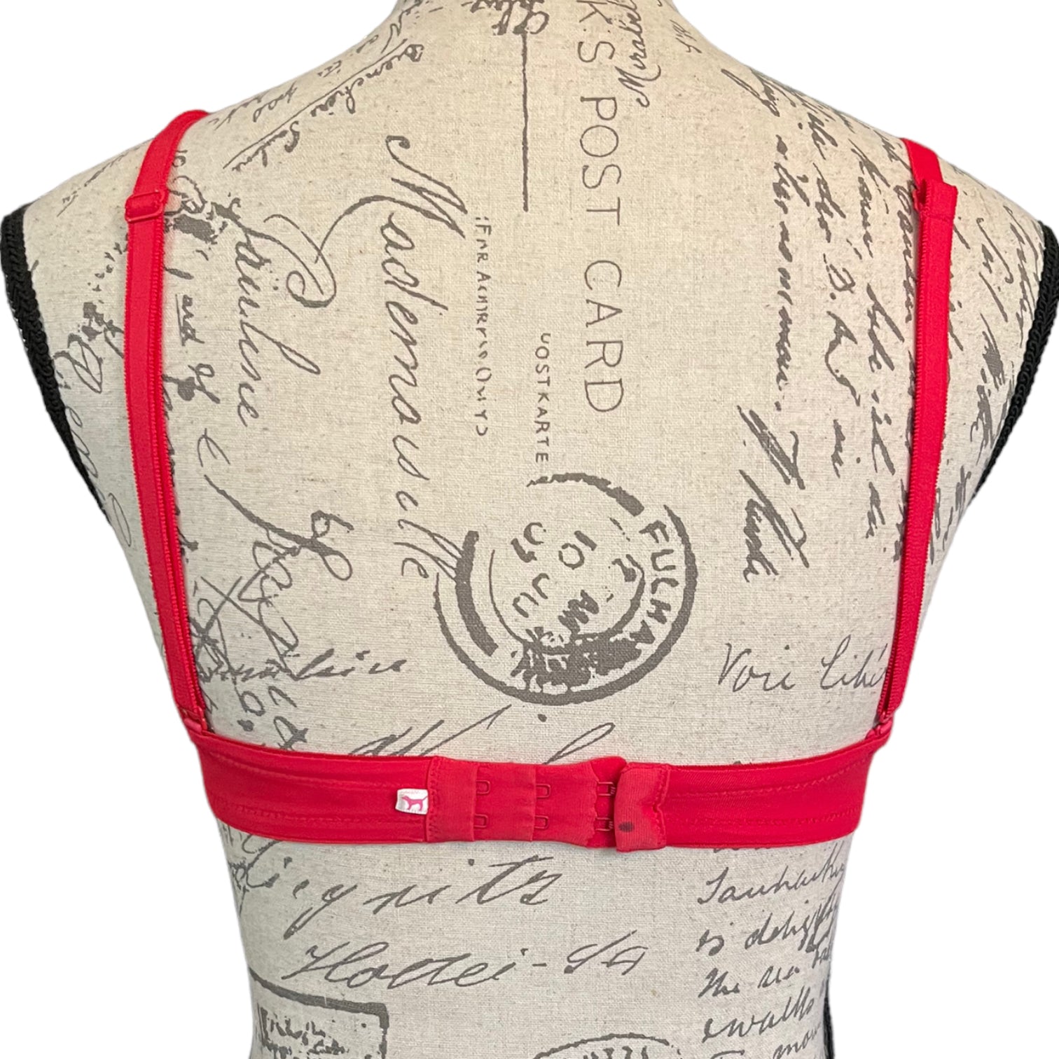 Back of red bra with black mark