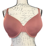 Front of Pink bra on a mannequin with a script background