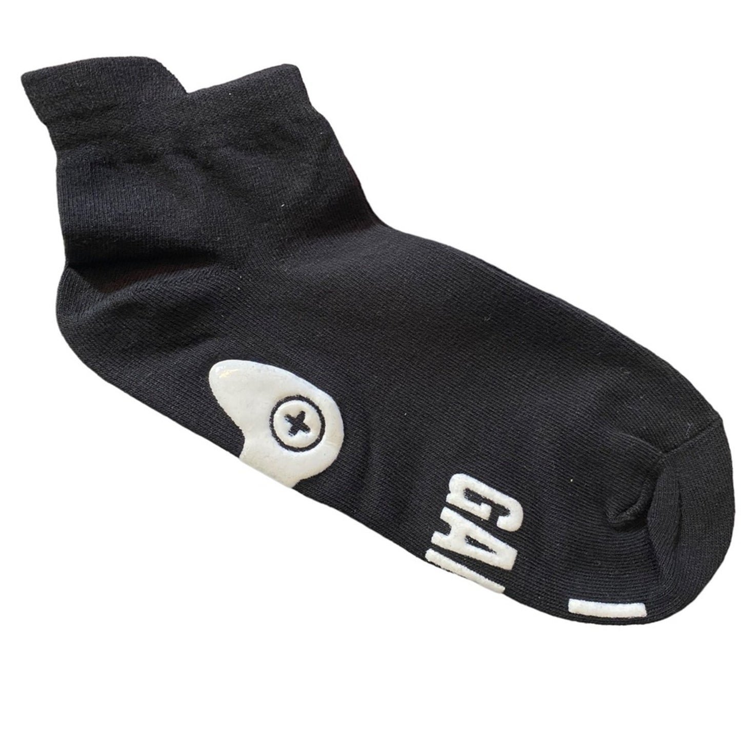 Black socks with white print on a white background