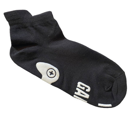 Black socks with white print on a white background