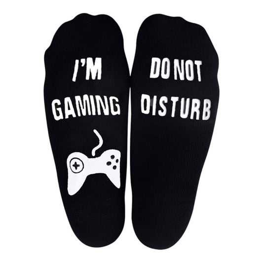 Bottom of black socks with white print on a shite background