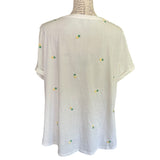 Back of white pineapple shirt